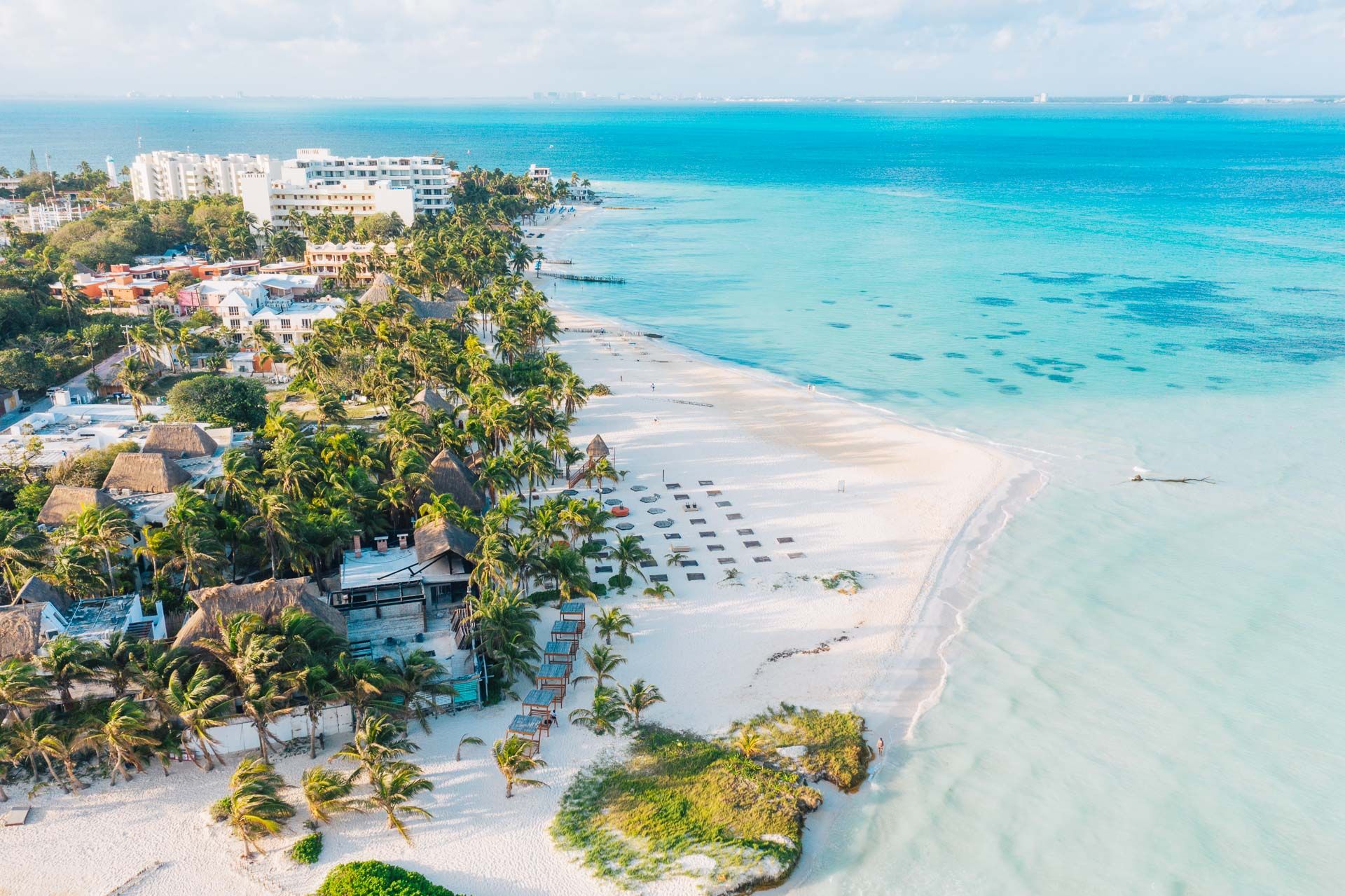 Isla Mujeres vs Playa Mujeres—North Beach and resort-zone shoreline side by side.