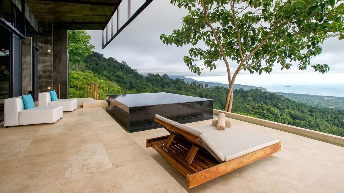 Infinity pool at a boutique hotel in Costa Rica over rainforest